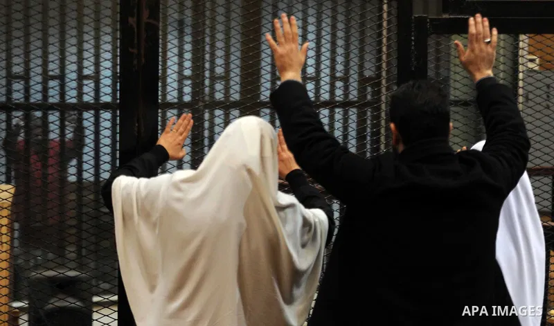 Relatives of Ousted Egyptian president Mohammed Morsi attend his trail as part of the so-called 'Qatar espionage' case, in a court in Cairo on january 2, 2015. The defendants are accused of 'leaking important national se...