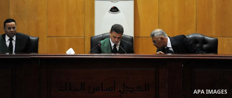An Egyptian Judge attends the trial of ousted Egyptian president Mohammed Morsi, during the 'Qatar espionage' case, in a court in Cairo on january 2, 2015. The defendants are accused of 'leaking important national securi...