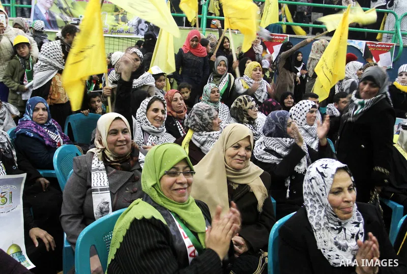 Palestinian Fatah supporters celebrate during a rally as they mark the 51st anniversary of the founding of the Fatah movement, in Rafah in the southern of Gaza strip Jan. 03, 2016. Photo by Abed Rahim Khatib