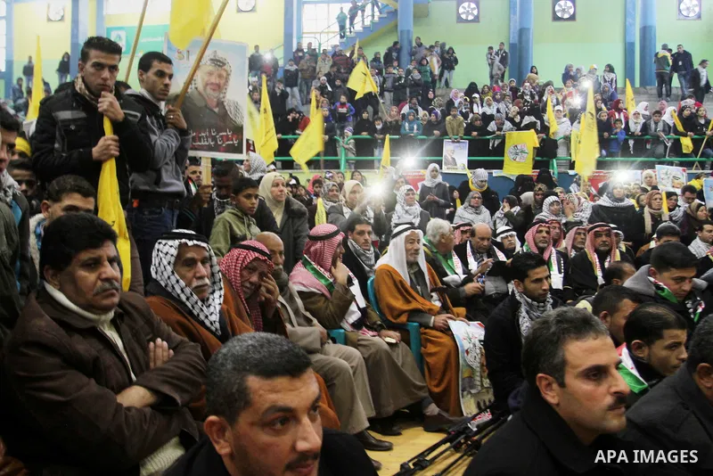 Palestinian Fatah supporters celebrate during a rally as they mark the 51st anniversary of the founding of the Fatah movement, in Rafah in the southern of Gaza strip Jan. 03, 2016. Photo by Abed Rahim Khatib