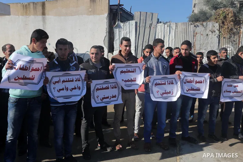 Palestinian students take part in a protest demanding reconstruction of the schools, in Gaza city, on January 4, 2016. Photo by Mohammed Asad