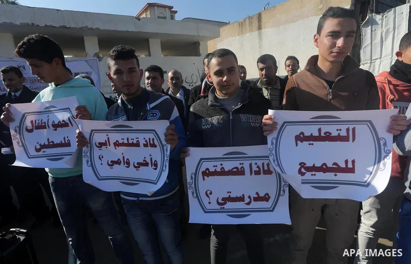 Palestinian students take part in a protest demanding reconstruction of the schools, in Gaza city, on January 4, 2016. Photo by Mohammed Asad