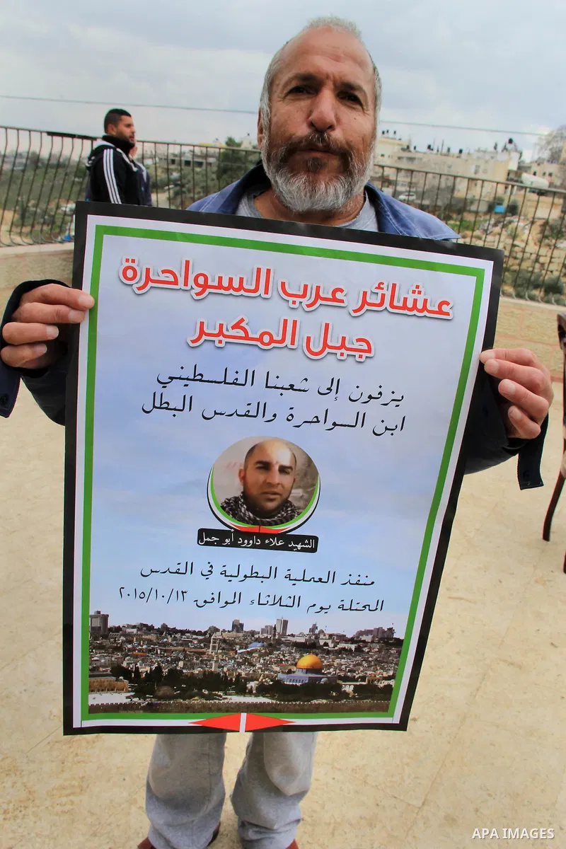 Palestinians take part in a protest in front of Alaa Abu Jamal house, during Israeli security forces filled with concrete and sealed off the Abu Jamal family house in the east Jerusalem Palestinian neighbourhood of Jabal...