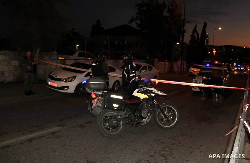 Israeli forensic police investigate the site of an attack near Jerusalem's light rail train service on January 4, 2016, after a Palestinian tried to stab security forces, police said. A 15-year-old Israeli girl was light...