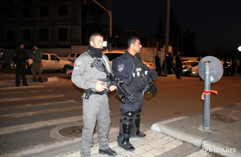 Israeli security forces stand guard at the site of an attack near Jerusalem's light rail train service on January 4, 2016, after a Palestinian tried to stab security forces, police said. A 15-year-old Israeli girl was li...