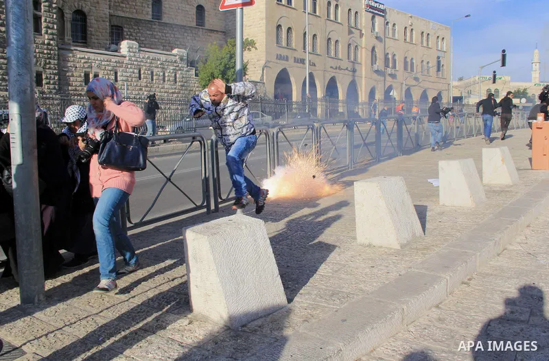 Israeli anti-riot policemen disperse Palestinian protesters at Damascus Gate in Jerusalem's Old City on January 5, 2016, as they demonstrate calling for the Israeli authorities to the return to their families the bodies...
