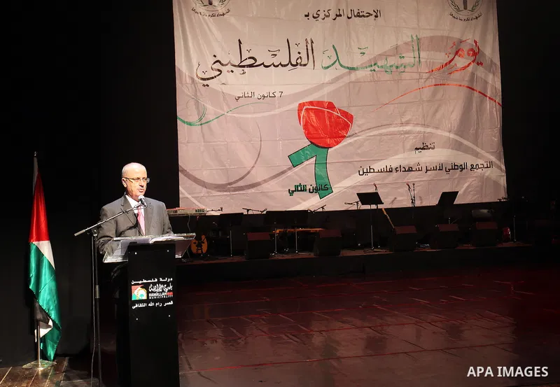 Palestinian Prime Minister, Rami Hamdallah, takes part in the celebration on the day of the Palestinian martyr, in the West bank city of Ramallah, on January 6, 2016. Photo by Prime Minister Office