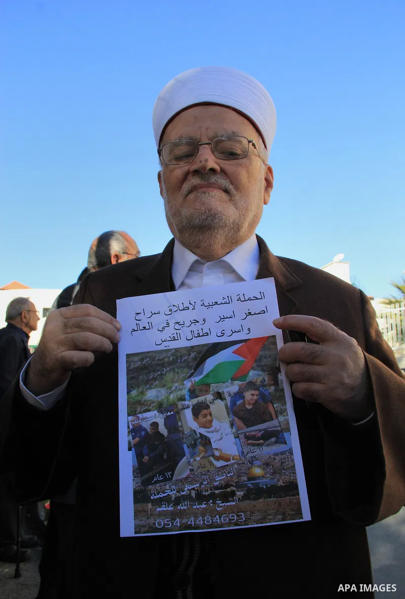 Head of the Supreme Islamic Council, Sheikh Ikrima Sabri takes part in a protest to show solidarity with two Palestinian children, Muawiya Alqam,14, and his brother Ali,11, during their trial, outside an Israeli court in...