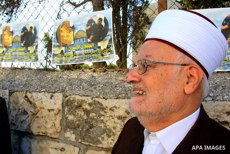 Head of the Supreme Islamic Council, Sheikh Ikrima Sabri takes part in a protest to show solidarity with two Palestinian children, Muawiya Alqam,14, and his brother Ali,11, during their trial, outside an Israeli court in...