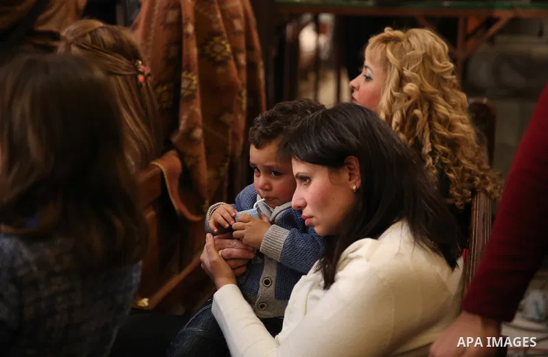 Egyptian Christians take part in the Coptic Orthodox Christmas Eve mass in St. Mark church in Cairo on January 6, 2016. Photo by Stringer