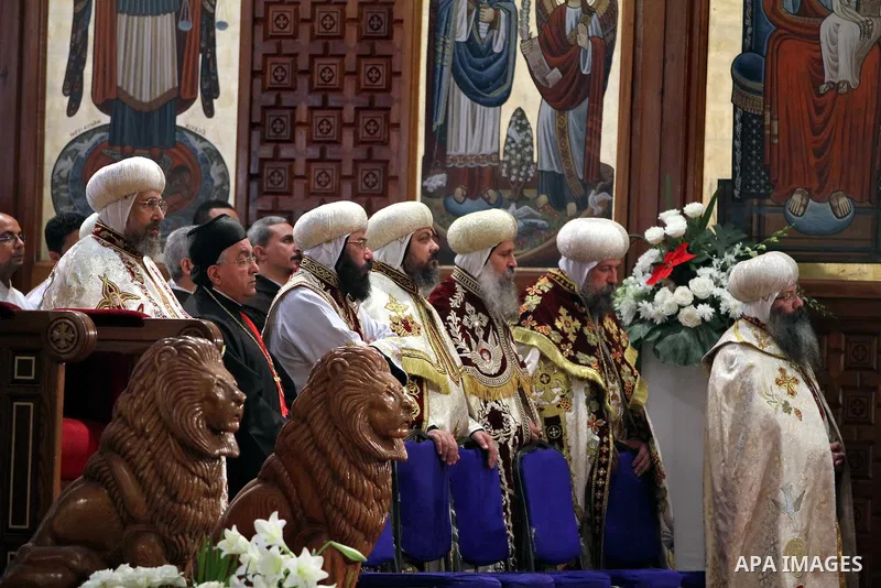 Egyptian Christians take part in the Coptic Orthodox Christmas Eve mass in St. Mark church in Cairo on January 6, 2016. Photo by Stringer