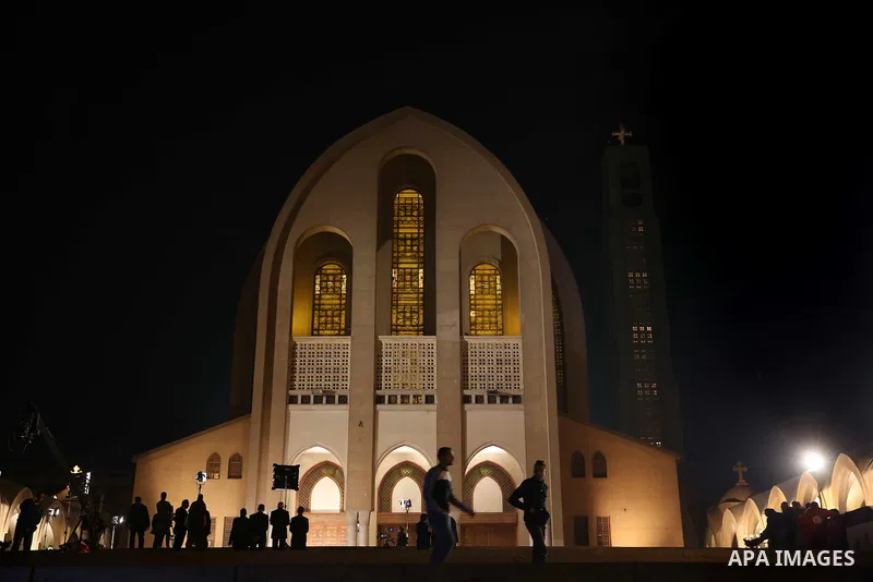Egyptian Christians take part in the Coptic Orthodox Christmas Eve mass in St. Mark church in Cairo on January 6, 2016. Photo by Stringer