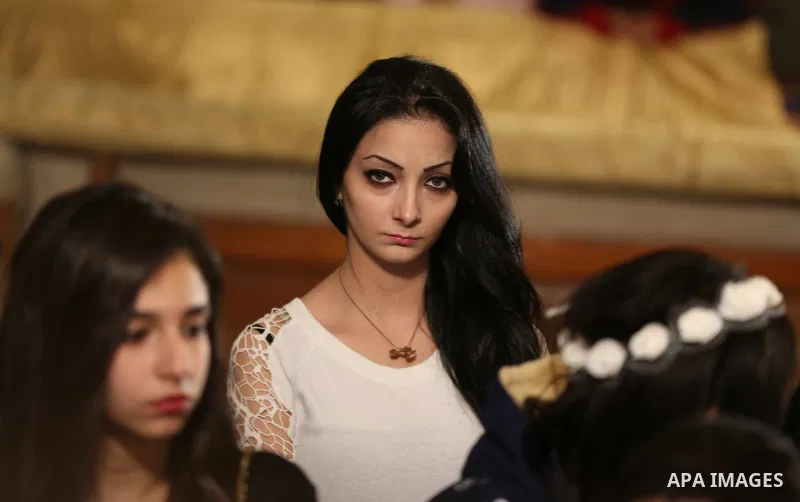 Egyptian Christians take part in the Coptic Orthodox Christmas Eve mass in St. Mark church in Cairo on January 6, 2016. Photo by Stringer