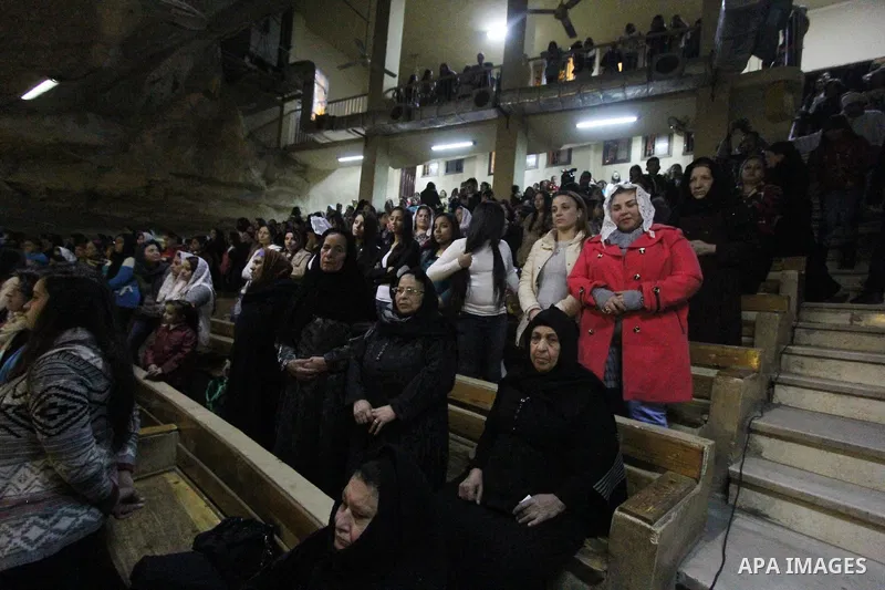Egyptian Christians take part in the Coptic Orthodox Christmas Eve mass in Deir Simon Church in Cairo on January 6, 2016. Photo by Stringer