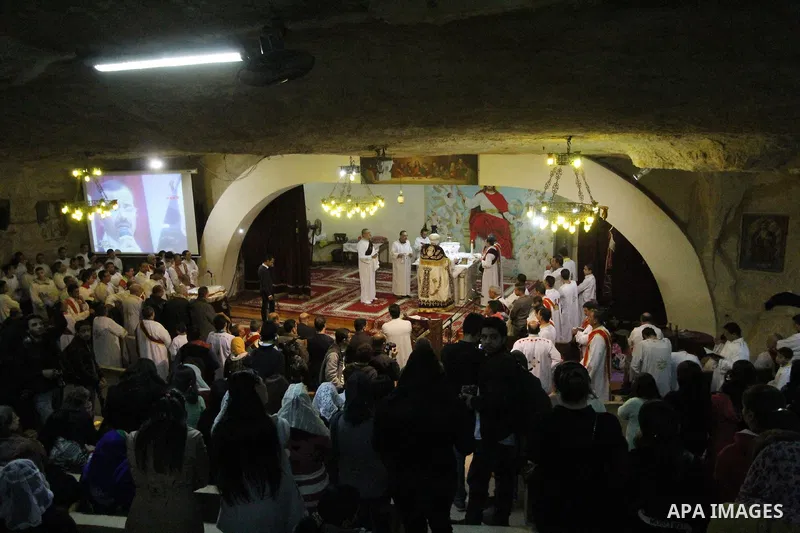 Egyptian Christians take part in the Coptic Orthodox Christmas Eve mass in Deir Simon Church in Cairo on January 6, 2016. Photo by Stringer