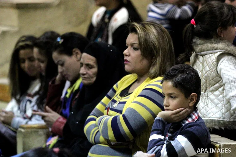 Egyptian Christians take part in the Coptic Orthodox Christmas Eve mass in Deir Simon Church in Cairo on January 6, 2016. Photo by Stringer
