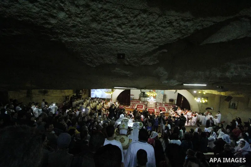Egyptian Christians take part in the Coptic Orthodox Christmas Eve mass in Deir Simon Church in Cairo on January 6, 2016. Photo by Stringer