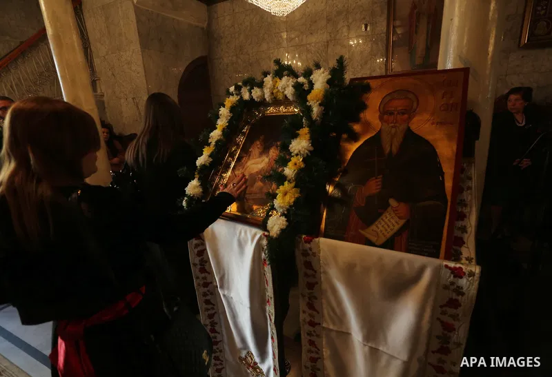 Palestinian Greek Orthodox Christians attend Christmas mass at the Orthodox Saint Porfirios church in Gaza City on January 7, 2016. The Orthodox Church celebrates Christmas and other religious holidays according to the J...