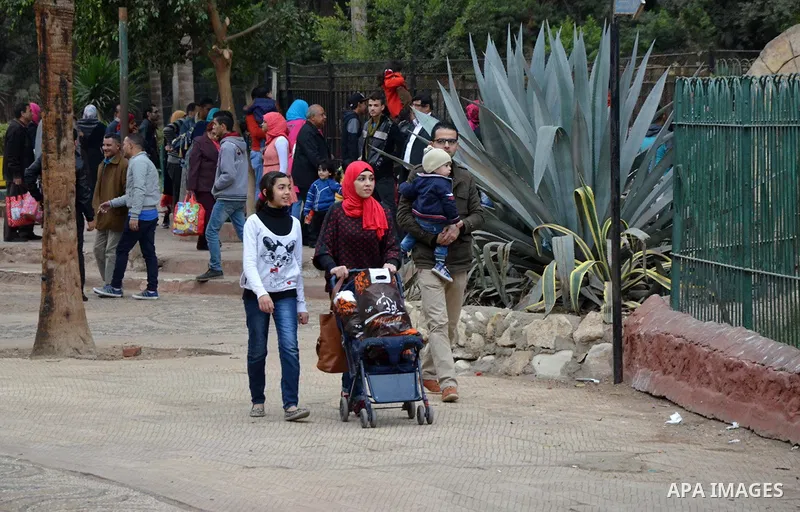 Egyptians enjoy at a zoo in a holiday, in Cairo, Egypt, on January 7, 2016. Photo by Amr Sayed