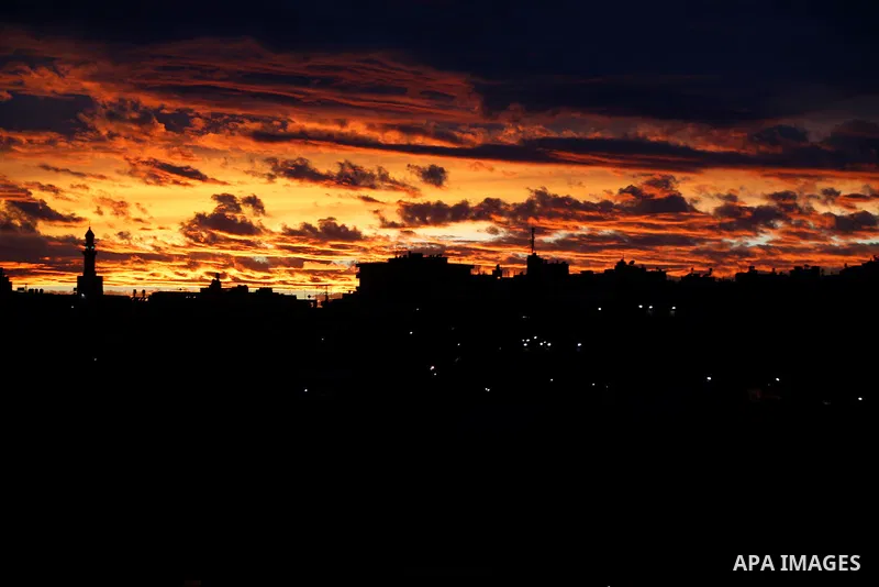Sunset is seen over the West Bank city of Hebron on Jan. 07, 2016. Photo by Wisam Hashlamoun