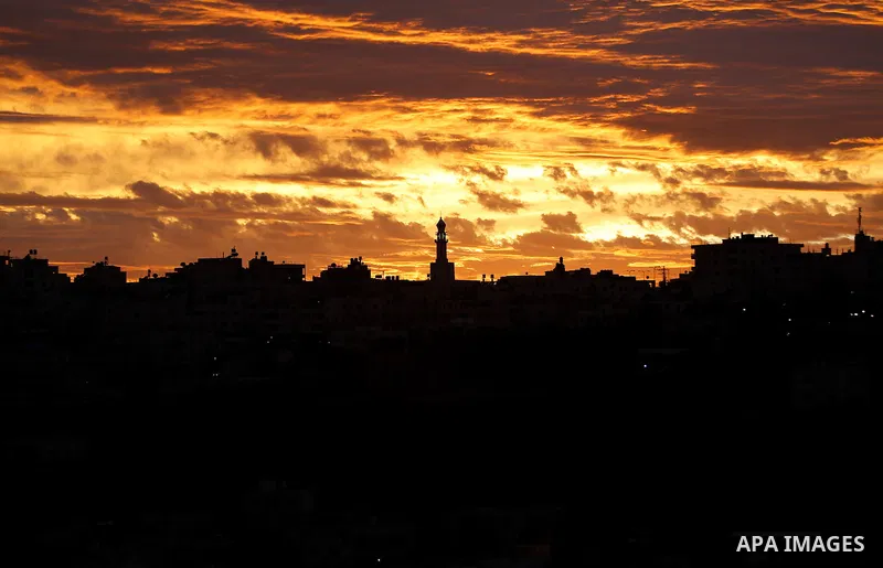 Sunset is seen over the West Bank city of Hebron on Jan. 07, 2016. Photo by Wisam Hashlamoun