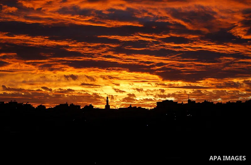 Sunset is seen over the West Bank city of Hebron on Jan. 07, 2016. Photo by Wisam Hashlamoun