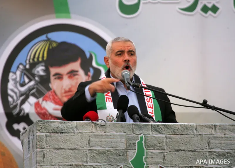 Senior Hamas leader Ismail Haniyeh speaks during a rally in Khan Yunis in the southern Gaza Strip on January 7, 2016. The rally was held to honor the families of dead militants from the armed wing, who Hamas said partici...