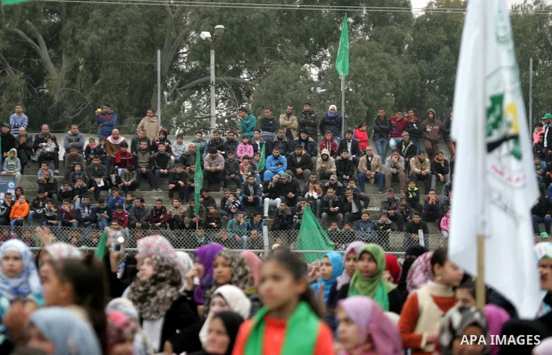 Palestinians attend a rally by Hamas militants in Khan Yunis in the southern Gaza Strip on January 7, 2016. The rally was held to honor the families of dead militants from the armed wing, who Hamas said participated in i...