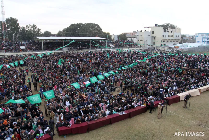 Palestinians attend a rally by Hamas militants in Khan Yunis in the southern Gaza Strip on January 7, 2016. The rally was held to honor the families of dead militants from the armed wing, who Hamas said participated in i...