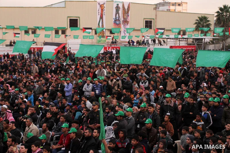 Palestinians attend a rally by Hamas militants in Khan Yunis in the southern Gaza Strip on January 7, 2016. The rally was held to honor the families of dead militants from the armed wing, who Hamas said participated in i...