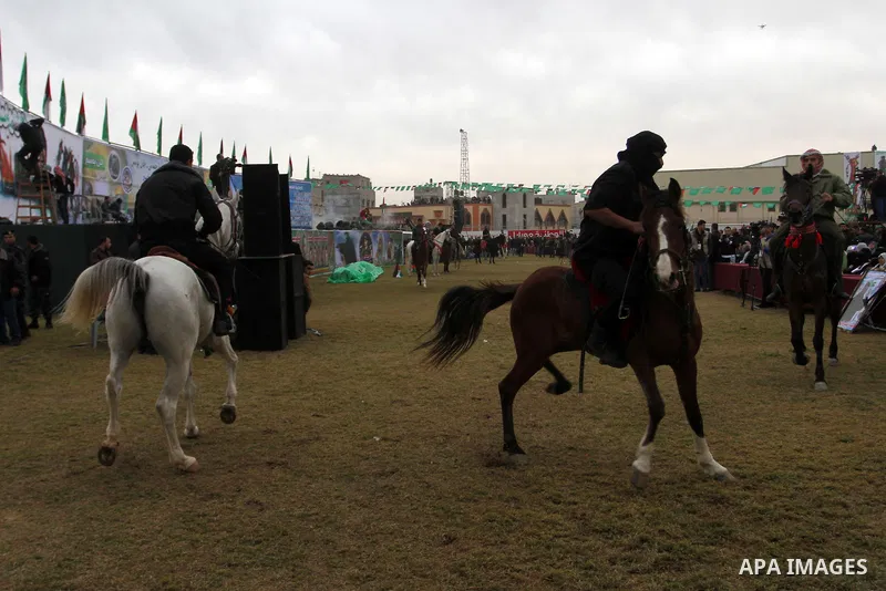 Palestinians loyal to the Hamas movement sit on a horse during a rally in Khan Yunis in the southern Gaza Strip on January 7, 2016. The rally was held to honor the families of dead militants from the armed wing, who Hama...