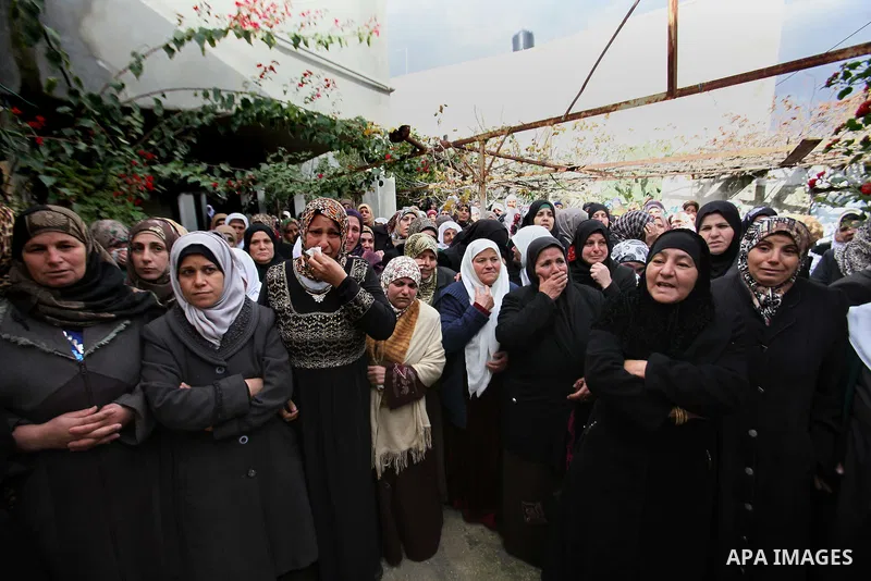 Mourners carry the body of Palestinian Ali Abu Maryam, 22 , who was killed by Israeli troops, during his funeral in the West Bank of jenin, on January 9, 2016. Israeli troops shot dead two Palestinian men at a checkpoint...