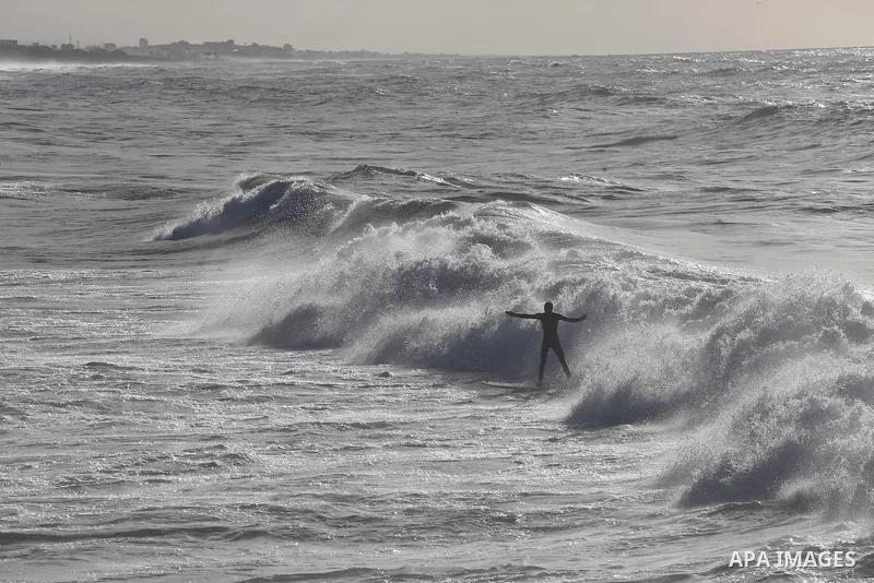 Palestinian youth enjoy water skiing in the Mediterranean Sea in Gaza City on January 10, 2016. Photo by Mohammed Asad