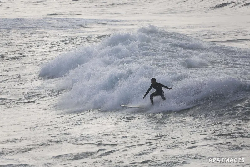 Palestinian youth enjoy water skiing in the Mediterranean Sea in Gaza City on January 10, 2016. Photo by Mohammed Asad