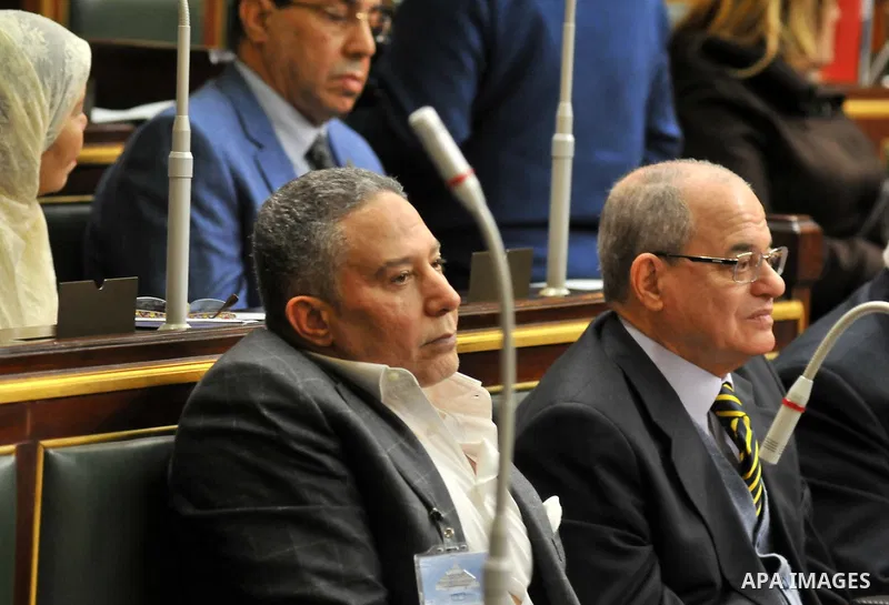 Staff members attend the swearing-in session of the Parliament during the first meeting of Egypt's newly elected parliament, inside the People's Assembly for the opening session of the new parliament in Cairo, Egypt, on...