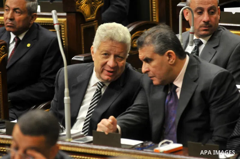 Staff members attend the swearing-in session of the Parliament during the first meeting of Egypt's newly elected parliament, inside the People's Assembly for the opening session of the new parliament in Cairo, Egypt, on...