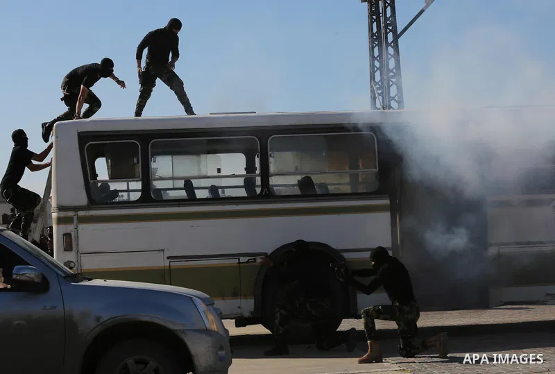Members of Palestinian security forces loyal to Hamas demonstrate their skills during a military graduation ceremony in Gaza City January 10, 2016. Photo by Mohammed Asad
