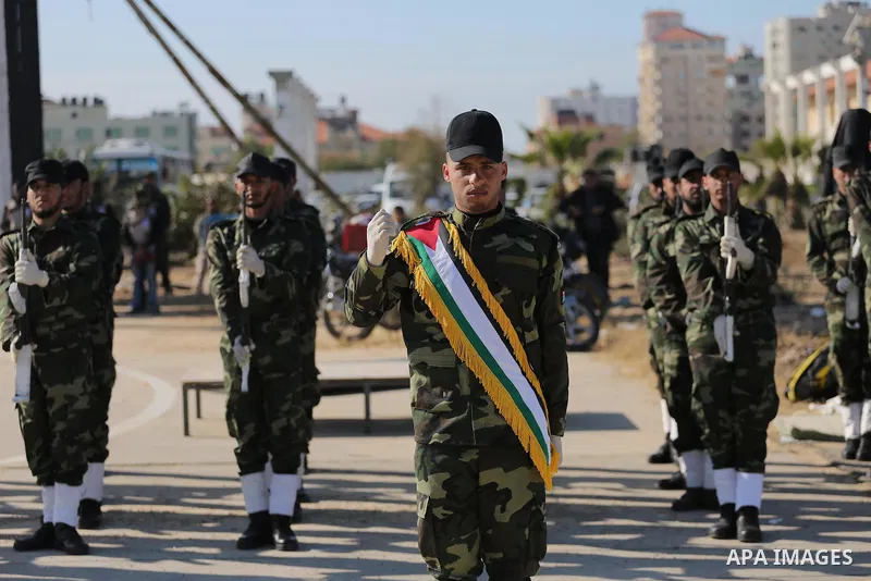 Members of Palestinian security forces loyal to Hamas demonstrate their skills during a military graduation ceremony in Gaza City January 10, 2016. Photo by Mohammed Asad