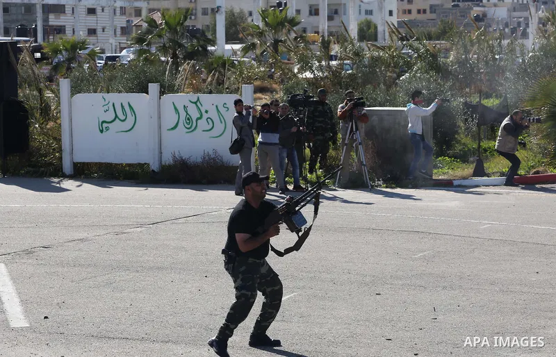 Members of Palestinian security forces loyal to Hamas demonstrate their skills during a military graduation ceremony in Gaza City January 10, 2016. Photo by Mohammed Asad