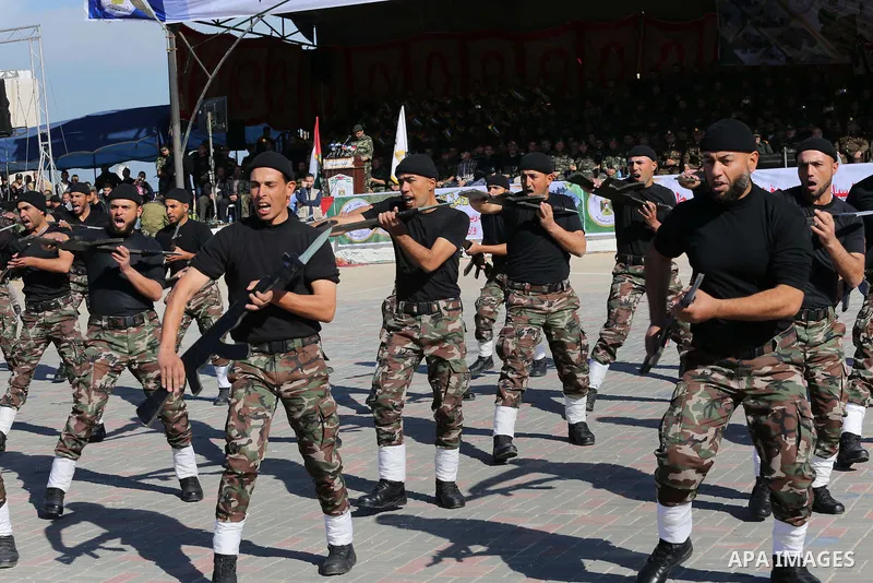 Members of Palestinian security forces loyal to Hamas demonstrate their skills during a military graduation ceremony in Gaza City January 10, 2016. Photo by Mohammed Asad