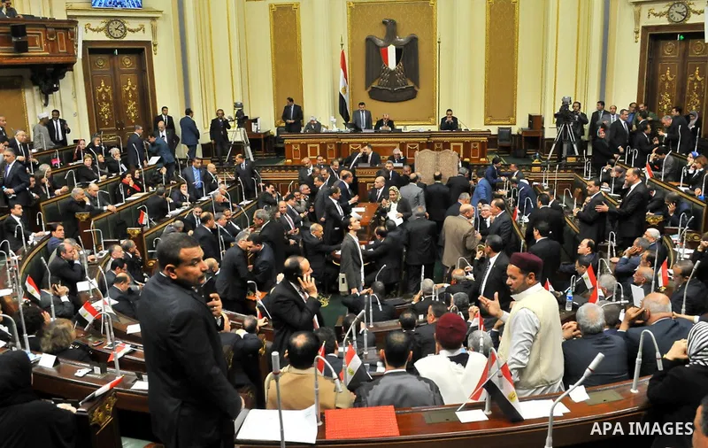 Members of Egypt's Parliament attend the inaugural session, the first to convene in three years, in Cairo, Egypt, Sunday, Jan. 10, 2016. The 596-seat assembly, elected in November and December, packed with supporters of...