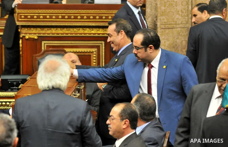Members of Egypt's Parliament attend the inaugural session, the first to convene in three years, in Cairo, Egypt, Sunday, Jan. 10, 2016. The 596-seat assembly, elected in November and December, packed with supporters of...