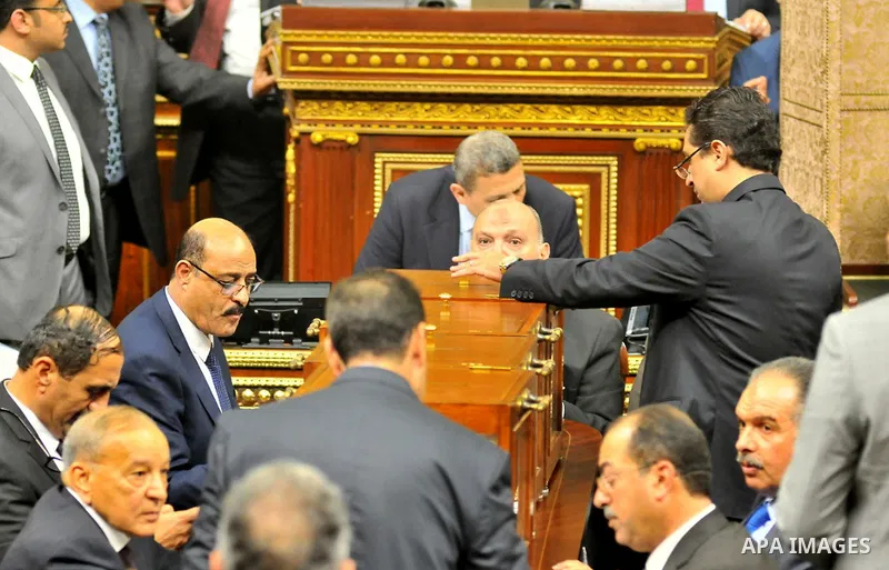 Members of Egypt's Parliament attend the inaugural session, the first to convene in three years, in Cairo, Egypt, Sunday, Jan. 10, 2016. The 596-seat assembly, elected in November and December, packed with supporters of...