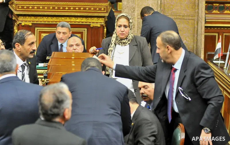 Members of Egypt's Parliament attend the inaugural session, the first to convene in three years, in Cairo, Egypt, Sunday, Jan. 10, 2016. The 596-seat assembly, elected in November and December, packed with supporters of...