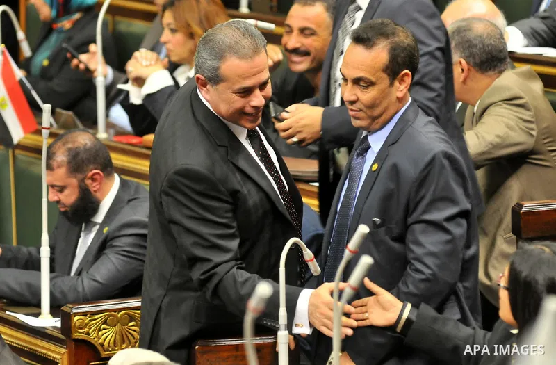 Members of Egypt's Parliament attend the inaugural session, the first to convene in three years, in Cairo, Egypt, Sunday, Jan. 10, 2016. The 596-seat assembly, elected in November and December, packed with supporters of...