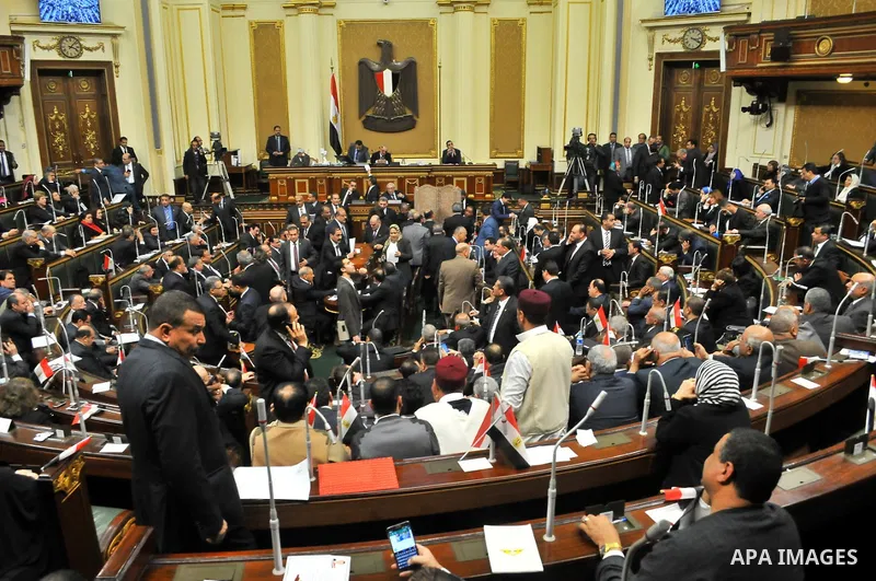 Members of Egypt's Parliament attend the inaugural session, the first to convene in three years, in Cairo, Egypt, Sunday, Jan. 10, 2016. The 596-seat assembly, elected in November and December, packed with supporters of...