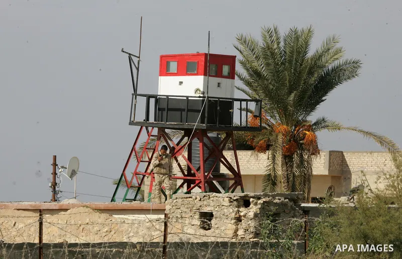 An Egyptian security guard during a protest demanding for Palestinian men abducted by unidentified masked gunmen, in front of the Gaza-Egypt border in Rafah in the southern Gaza Strip, on January 11, 2016. Photo by Abed...