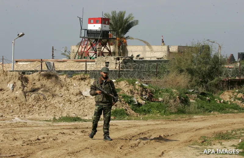 Palestinian officers stand guard during a protest demanding for Palestinian men abducted by unidentified masked gunmen, in front of the Gaza-Egypt border in Rafah in the southern Gaza Strip, on January 11, 2016. Photo by...