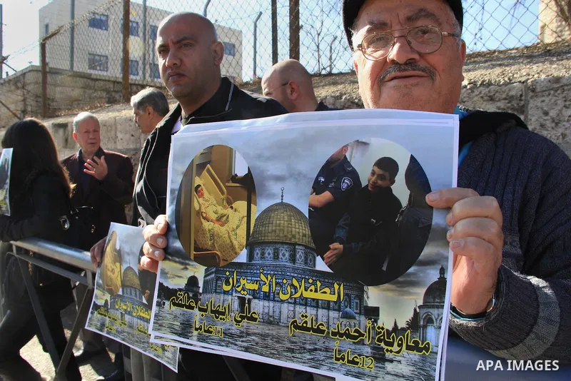 Palestinians take part in a protest demanding release the children prisoners in Israeli jails, outside an Israeli court in Jerusalem on January 12, 2016. Photo by Mahfouz Abu Turk