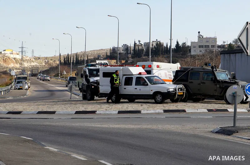 Israeli soldiers stand guard near the scene where two Palestinian men were shot dead by Israeli troops at the Beit Ainun junction northeast of Hebron in the occupied West Bank on Jan. 12, 2016. An Israeli army spokespers...